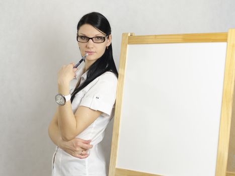 Working Girl thoughtfully her back to the white board