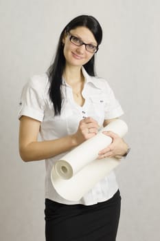 The girl in glasses is the roll of paper. Writes on a roll with a pencil. The architect. Designer.