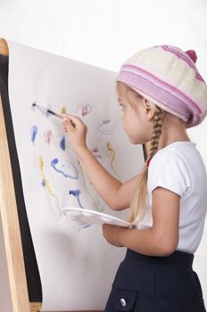 The girl in the image of the artist draws on the easel