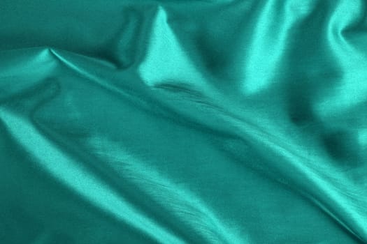 A background of a smooth and silky satin fabric.