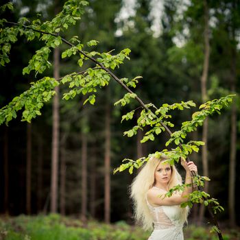 Lovely bride outdoors in a forest