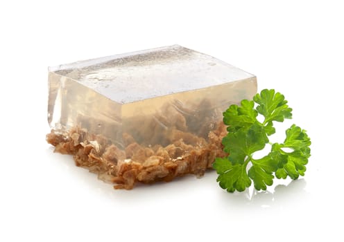Isolated piece of beef aspic with green fresh parsley
