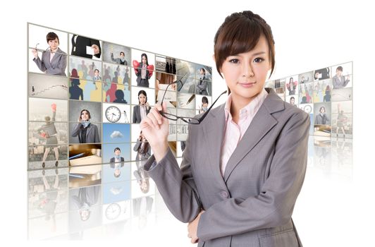 Attractive Asian business woman standing in front of TV screen wall, closeup portrait.