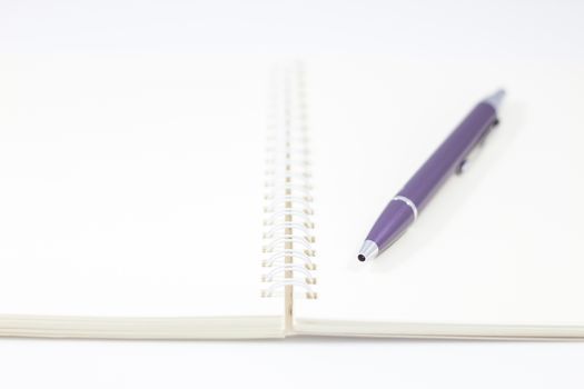 Pen and spiral notebook isolated on white background, stock photo