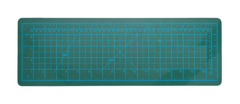 green cutting mat on a white background