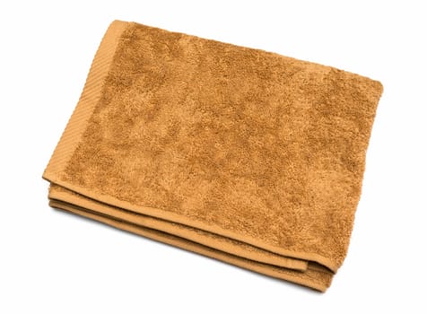 Light brown folded towel on white