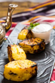 pineapple slices grilled. served with ice cream. dessert