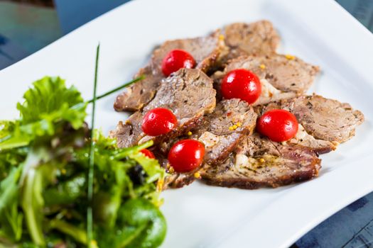 Hot beef and fresh vegetables as a healthy salad