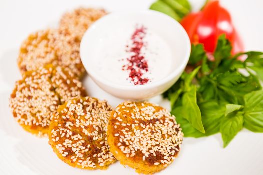 Middle East cuisine. a plate of delicious falafels and hummus. Vegetarian fare.