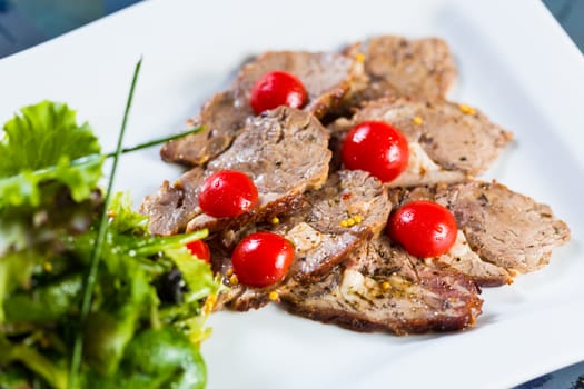 Hot beef and fresh vegetables as a healthy salad