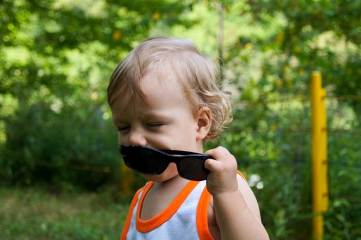 The amusing little boy on walk