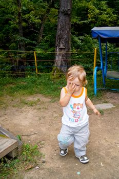 The amusing little boy on walk