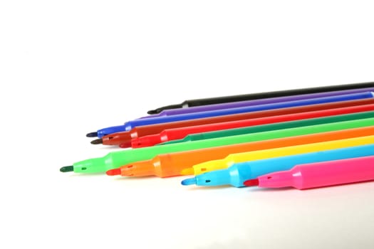 Twelve color marker pens on white background.