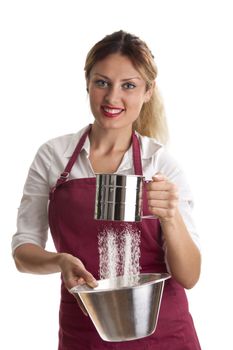 woman in an apron with a sieve