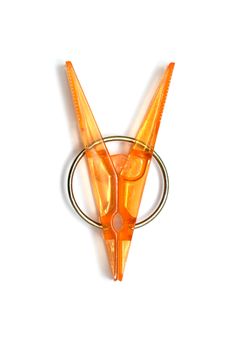 plastic clothespins with metal spring isolated on a white background