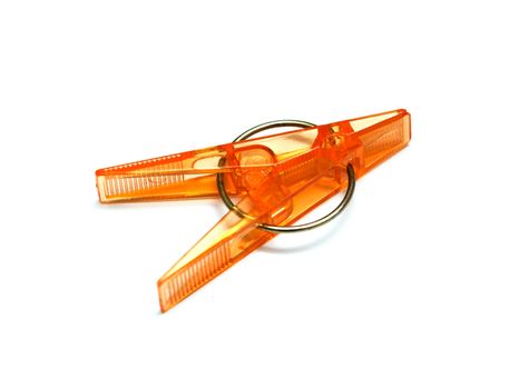 plastic clothespins with metal spring isolated on a white background