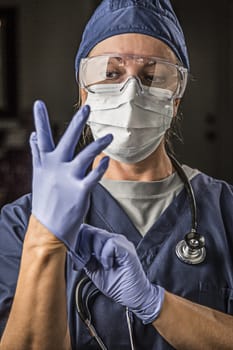 Concerned Female Doctor or Nurse Putting on Protective Facial Wear and Surgical Gloves.