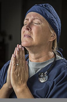 Pleading with Hands in Prayer Female Doctor or Nurse.