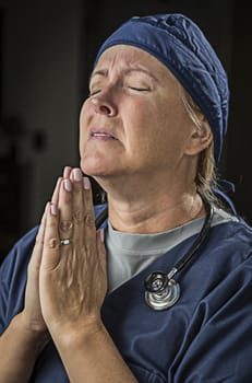 Pleading with Hands in Prayer Female Doctor or Nurse.