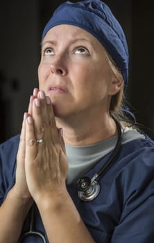 Pleading with Hands in Prayer Female Doctor or Nurse.