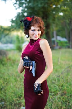 girl with gun on nature