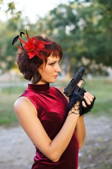 girl with gun on nature