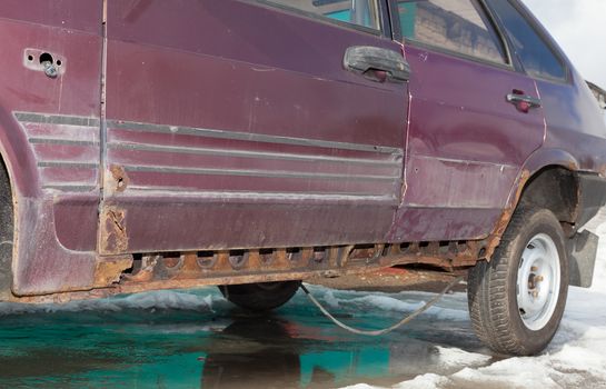 Body of a very old car with a rotten iron 