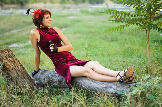 girl with gun on nature