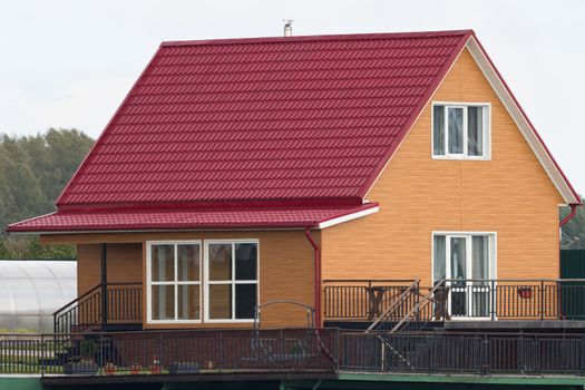 
Orange house with red roof