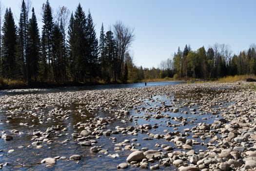 Fishing on the mountain river with fast current