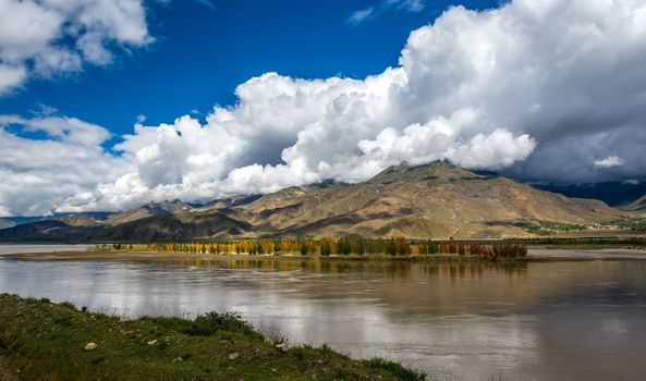 The Brahmaputra river with cloudy sky in Tibet.