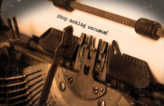 Close-up of a vintage typewriter, selective focus, stop making excuses