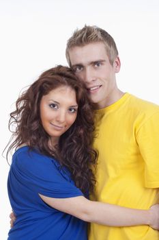 happy young couple - boy embracing girl, smiling - isolated on white