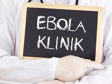 Doctor shows information: Ebola clinic in german language