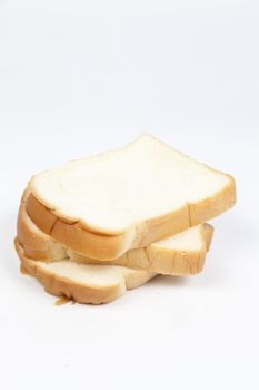 Sliced ������bread on a white background. Bread stacked in rows.