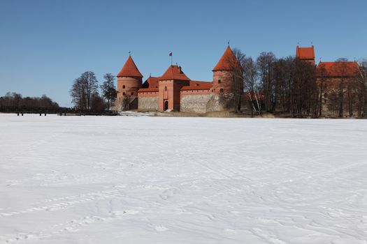 Trakai castle in Lithuania with frozen lake