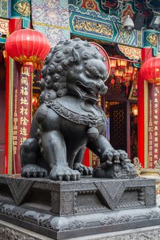 Lion statue in Wong Tai Sin Temple in Hong Kong, Asia.