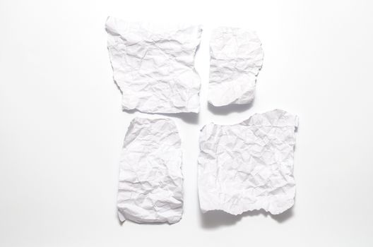 piece of white crumpled paper on a white background