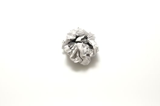 white crumpled paper ball on a white background