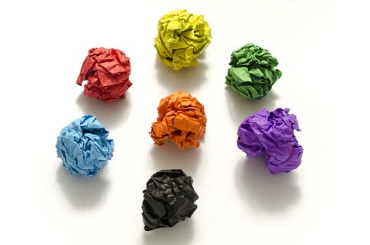 group of color crumpled paper ball on a white background