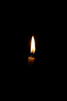 Candle in the dark background