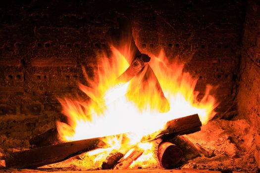 bonfire and flames in a fireplace