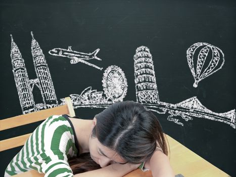 Asian woman dreaming and thinking travel holidays on blackboard
