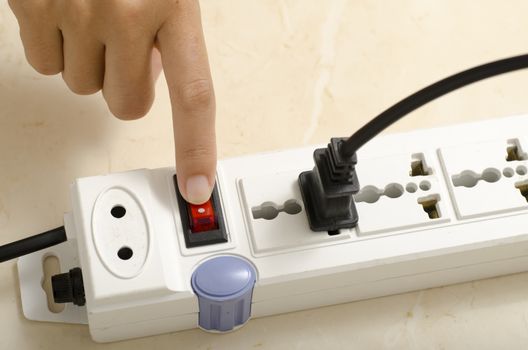 asia woman hand turn on switch multiple  socket plug electric
