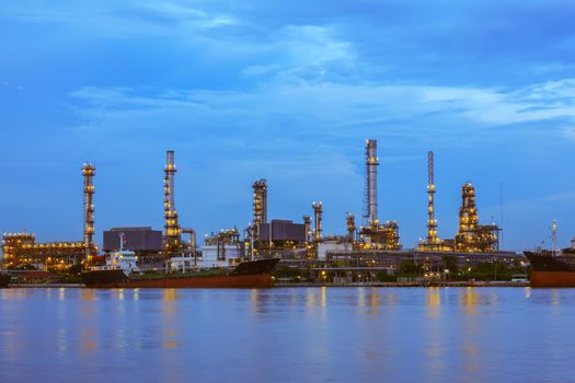 Oil refinery at twilight, business logistic concept