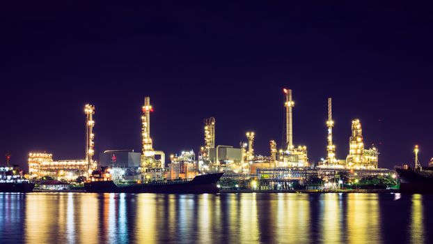 Oil refinery at twilight, business logistic concept