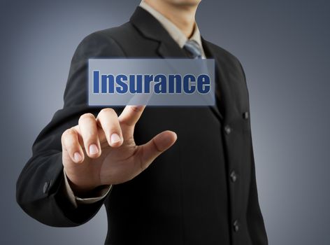 businessman hand pushing insurance button