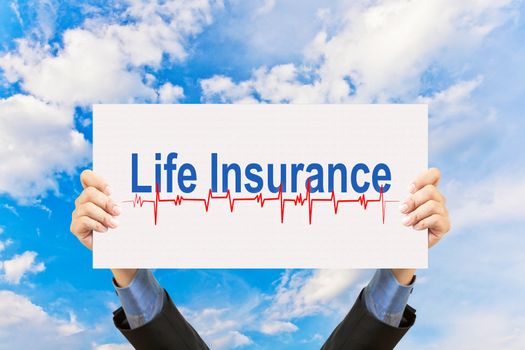 businessman holding life insurance concept and blue sky