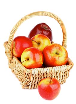 Fresh Ripe Red Prince Apples in Wicker Basket isolated on white background 