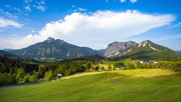 A beautiful view of the austrian alps with typical mountain houses, Austria